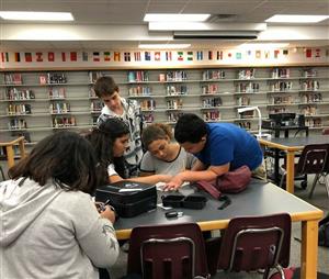 Students working on activity in the media center 
